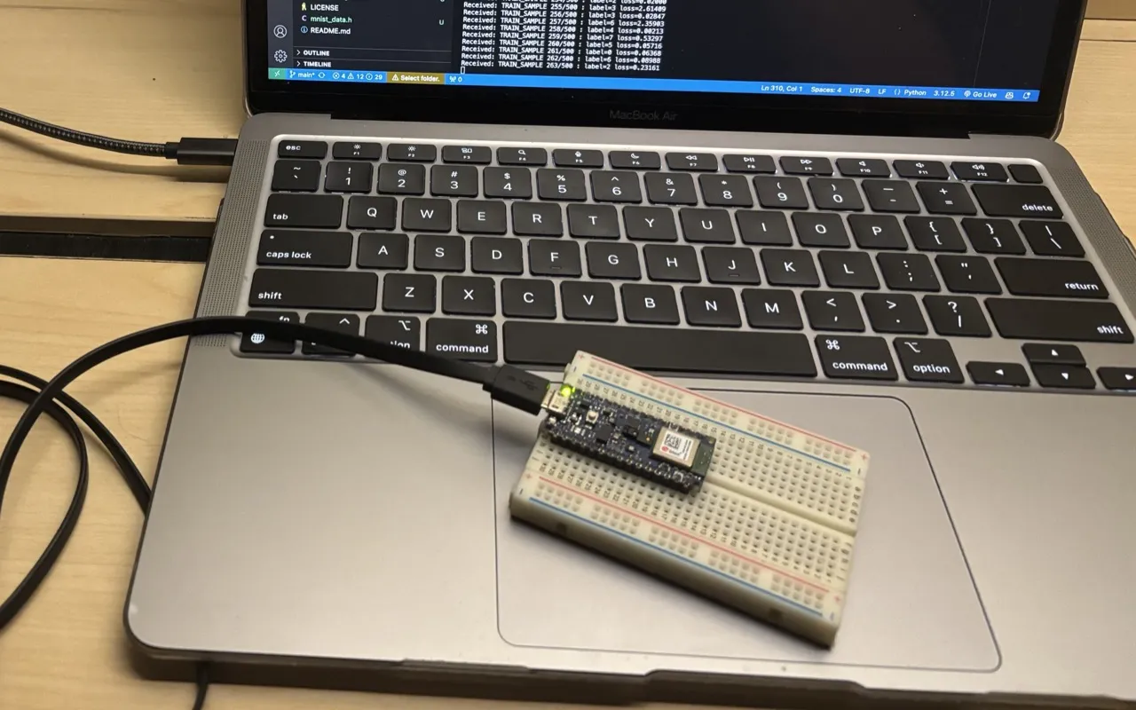 An Arduino Nano on a breadboard, plugged into a laptop whose terminal logs each training sample and its loss.
